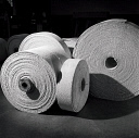 10414822
� NMeM - Walter Nurnberg
Pack shot of rolls of woven asbestos material at Turner Asbestos. England, 1960s.