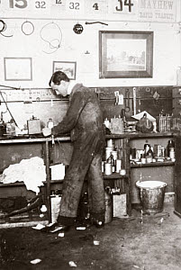 10327034
� Science Museum Archive
C S Rolls in overalls working in his garage, c 1900.