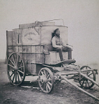 10316403
&copy; NMeM
Fenton's assistant, Marcus Sparling, on the photographic van, Crimea, c 1855.