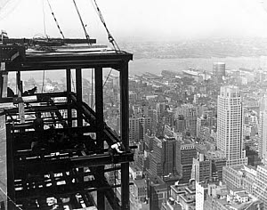 10316745
&copy; NMeM
Construction worker pulling up a rope, New York, c 1933.