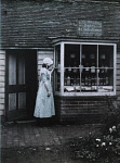 10465146
&copy; John Martin
Girl outside a sweetshop, c 1910-1915.