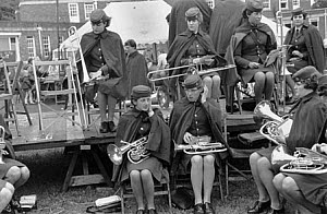 10307785
&copy; NMeM - Tony Ray-Jones
Band of women musicians in uniform, preparing to play at a festival, 1969.