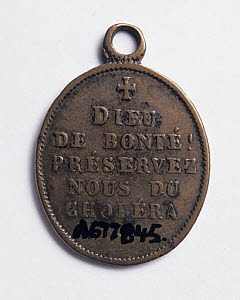 10318762
&copy; Science Museum
Oval amulet designed to protect against cholera, 19th century.