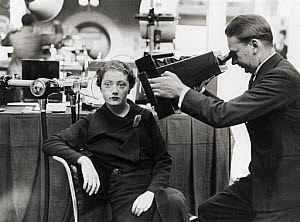 10250371
&copy; NMeM Associated Press
Woman having her head x-rayed, 15 October 1934.
