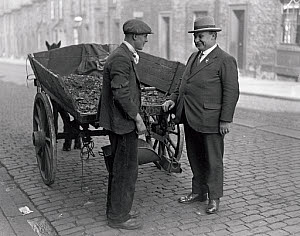 10323572
&copy; NMeM Daily Herald Archive
Ernest Bevin canvassing a street cleaner, Gateshead, 15 October 1931.