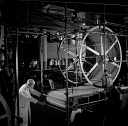 10414559
&copy; NMeM - Walter Nurnberg
Elderly worker with roll of coated match heads, Bryant and May factory, 1955.
