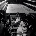 10414870
&copy; NMeM - Walter Nurnberg
A print worker checks the gate of a newspaper printing machine, Bolton.