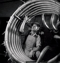 10414933
&copy; NMeM - Walter Nurnberg
Worker at Talbot Stead testing rolls of finished steel tubes, Walsall, 1948.