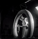 10414935
&copy; NMeM - Walter Nurnberg
A worker grinds a coiled steel tube at  Talbot Stead Steel Tubes, Walsall, 1948.