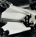 10416525
&copy; NMeM - Walter Nurnberg
Paper production, Blackburn, large rolls on machine with female cutter, 1959.