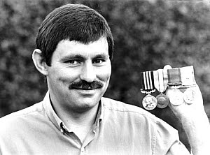 10462802
&copy; Manchester Daily Express
Bill Bentley with his campaign medals, 20 August 1986.