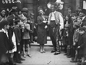10441027
&copy; NMeM Daily Herald Archive
Prince Monolulu and his bride surrounded by crowds, 19 August 1931.