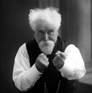 10423877
&copy; Science Museum
Sir Hiram Maxim with his fists raised, c 1900.