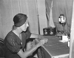 10320097
&copy; NMeM Daily Herald Archive
Amy Johnson making a broadcast from her hotel room, 18 December 1932.