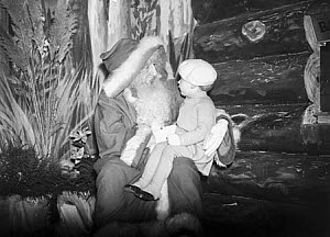 10262609
&copy; NMeM Daily Herald Archive
Father Christmas with a small child, 24 November 1936.