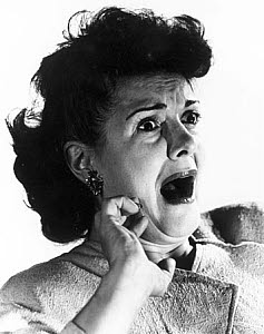 10327130
Woman gasping with terror, c 1940s.