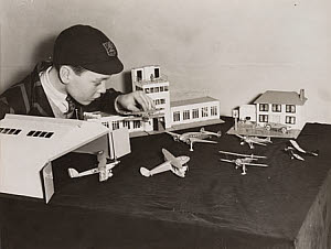 10468635
&copy; NMeM Daily Herald Archive
Boy with model airport, Selfridges, London, December 1936.