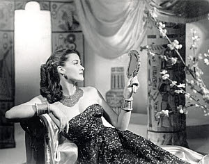 10327137
Glamorous young woman reclining on a couch, c 1945.