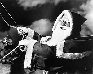 10327150
Father Christmas riding in his sleigh, c 1940s.