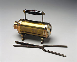 10182255
Crompton electric curling tong heater with tongs, 1891.