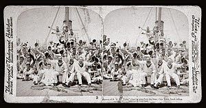 10303470
&copy; NMeM
Marines from HMS Niobe cheering news from the front, Cape Town�, 1900.