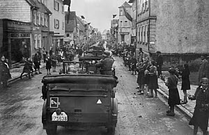 10465380
&copy; Nigel Dobinson
Girls welcoming army column, Germany, World War Two, 1940s.