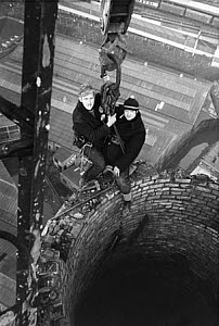 10465533
&copy; Manchester Daily Express
Steeplejacks on top of a chimney, March 1973.