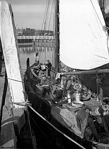 10309846
&copy; NMeM - Kodak Collection
Fishermen working on their boat, 1920s.