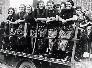 10250265
&copy; NMeM Daily Herald Archive
Fish curers on the back of a lorry, 22 October 1934.