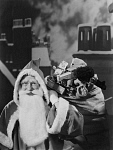 10429522
&copy; NMPFT - Photographic Advertising
Father Christmas on a snowy roof top, 1950.