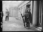 10432347
&copy; NMeM Daily Herald Archive
Soldier on guard wearing a chemical warfare suit, 1938.