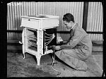 10431859
&copy; NMeM Daily Herald Archive
Wiring an electric stove, 1932.