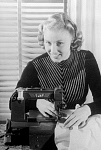 10429161
&copy; NMPFT - Photographic Advertising
Woman using a sewing machine, 1949.