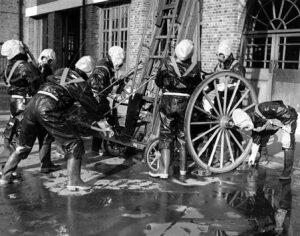 10308877
&copy; NMeM Daily Herald Archive
Winding up the escape ladder, 27 January 19
