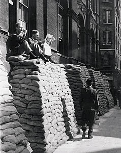 10313636
&copy; NMeM Daily Herald Archive
Men resting on top of piles of sandbags, WWII, London, 4 September 1939.